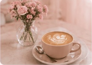 Latte with flowers on a cafe table